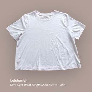Lululemon Ultra Light Waist Length Short Sleeve Shirt Pink XS/S see measurements